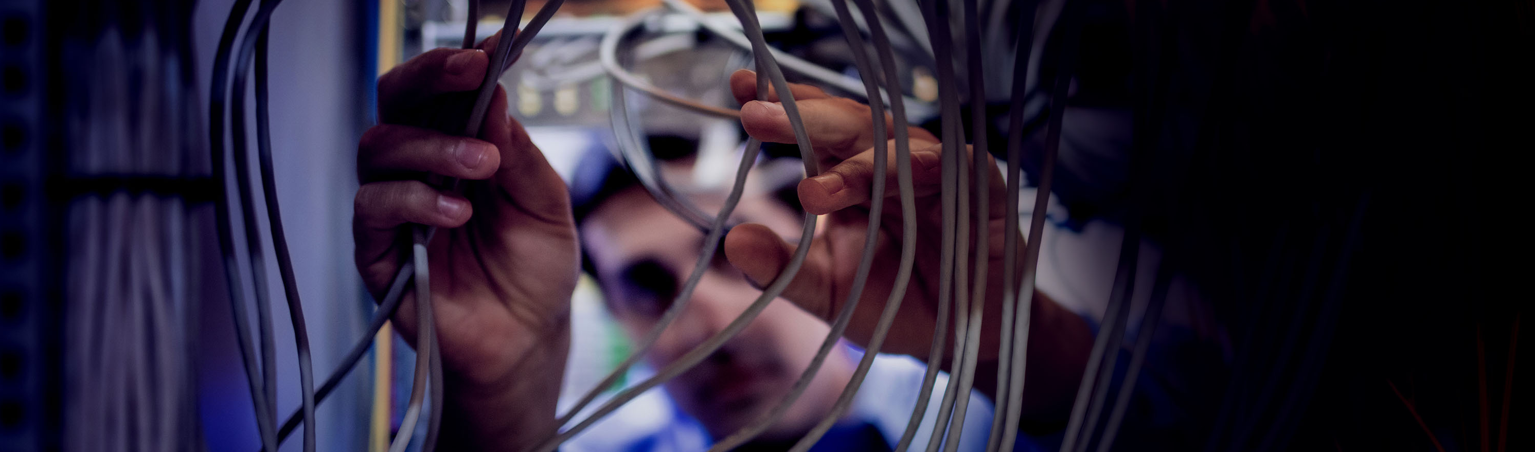 man fixing with cables